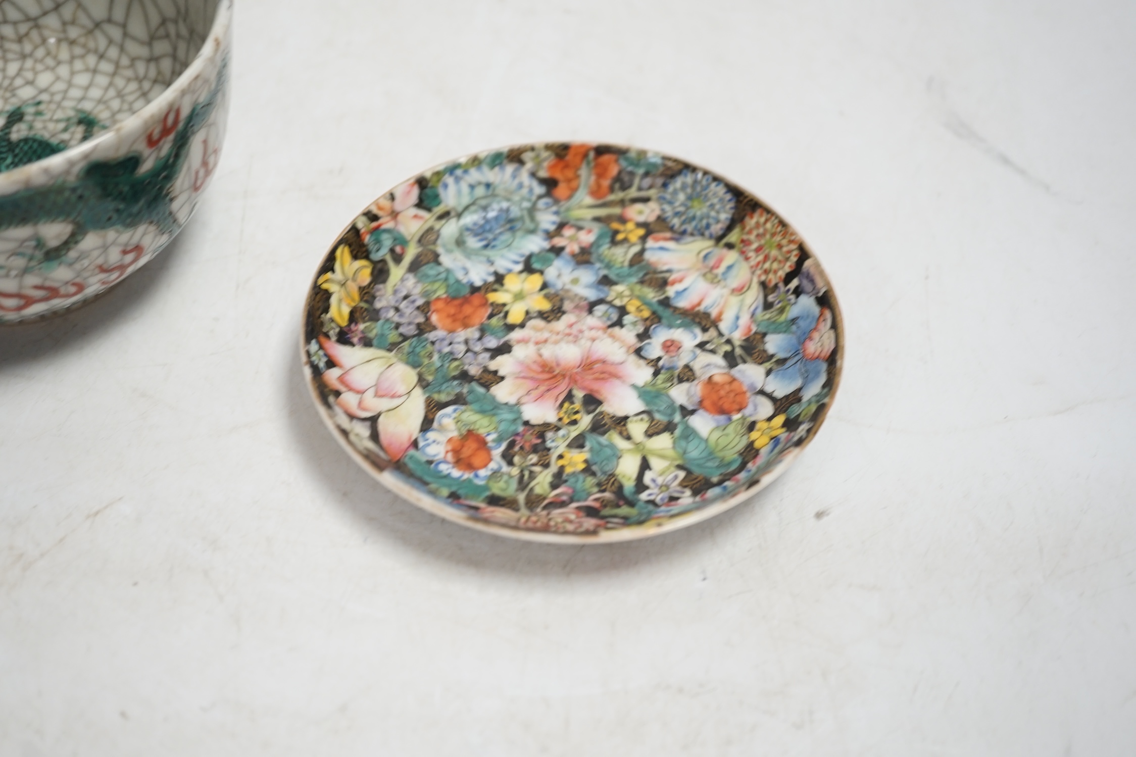A Chinese crackleglaze famille verte ‘dragon’ bowl and a millefleur cup and saucer, bowl 11cm diameter. Condition - fair